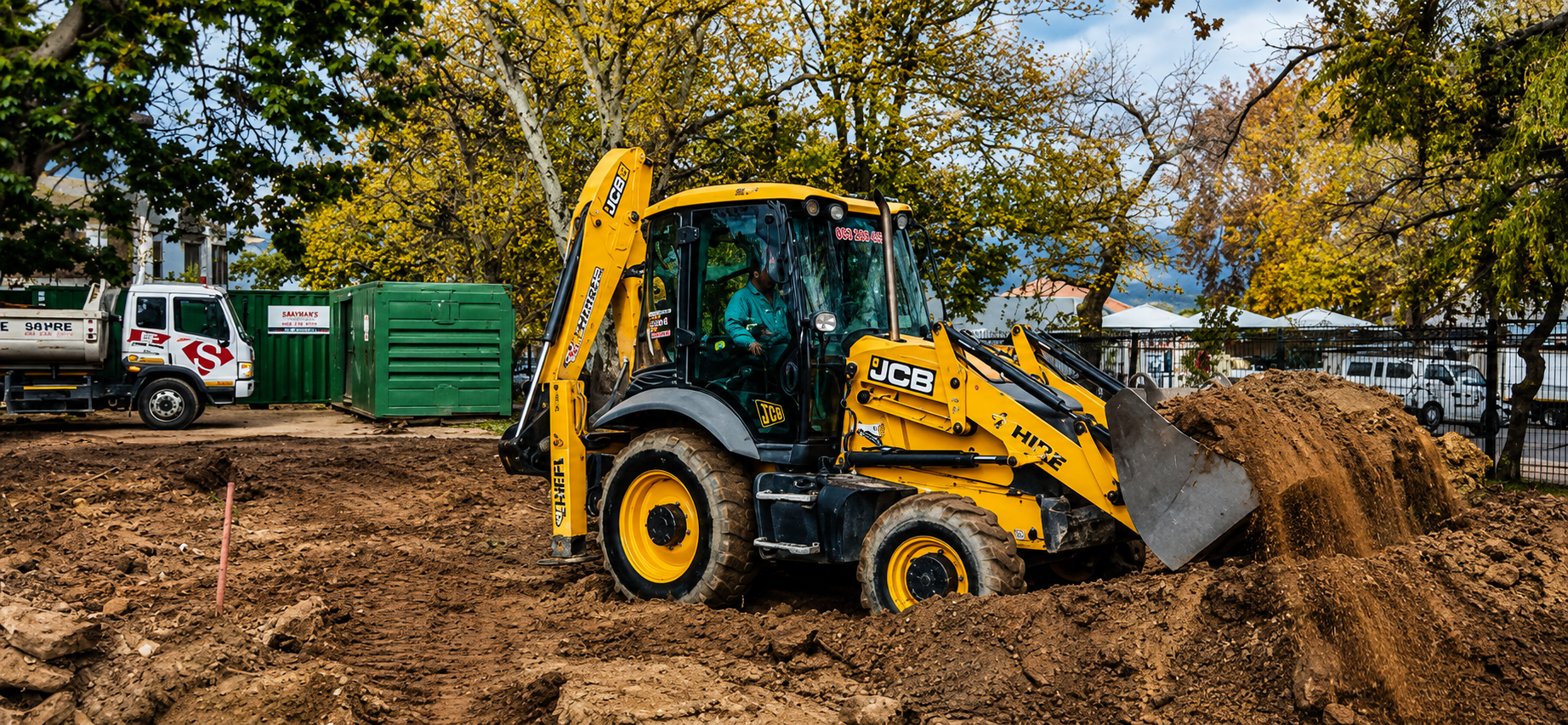 Demolition excavator clearing a site