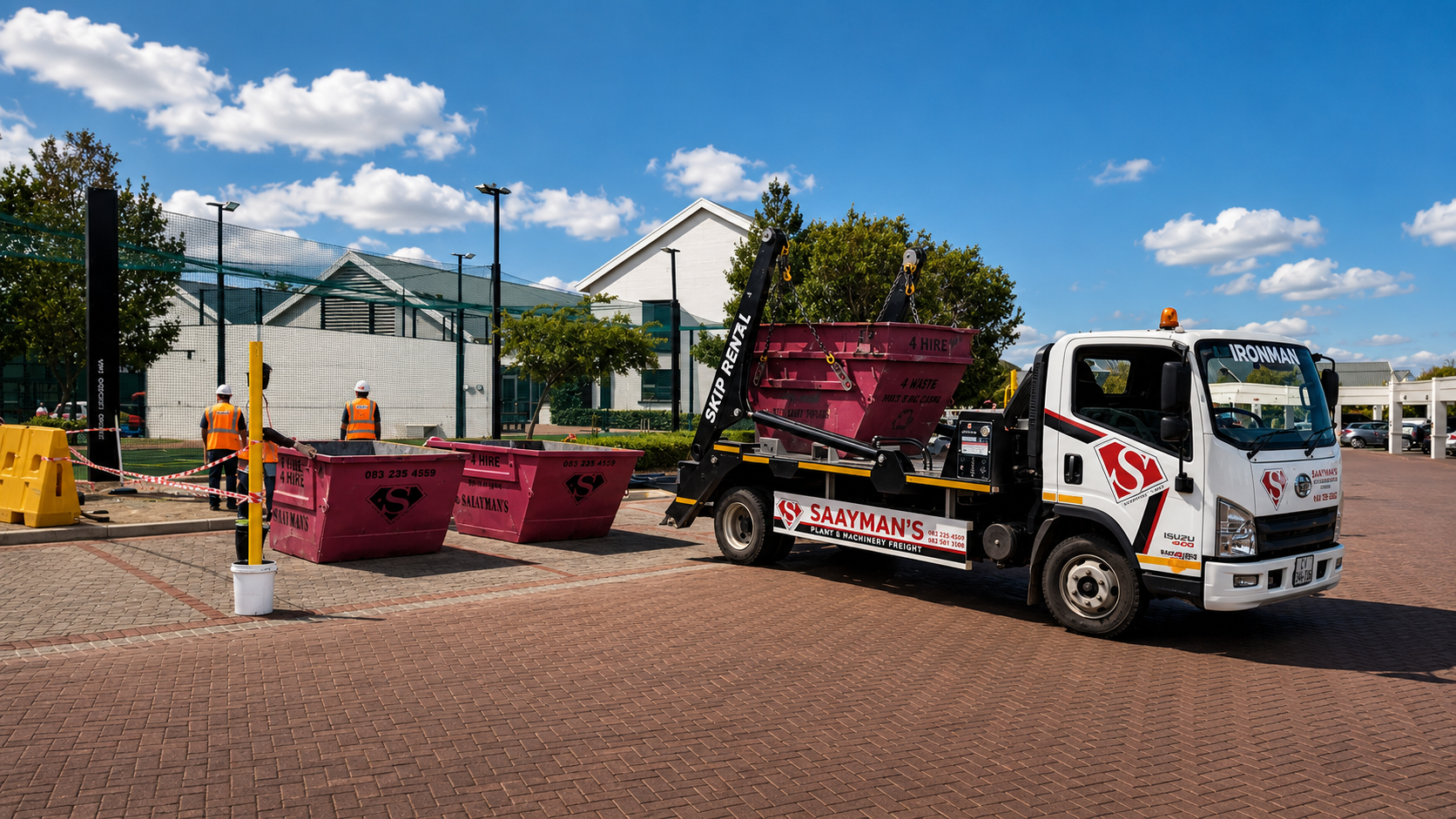 Skip hire truck lifting a waste skip